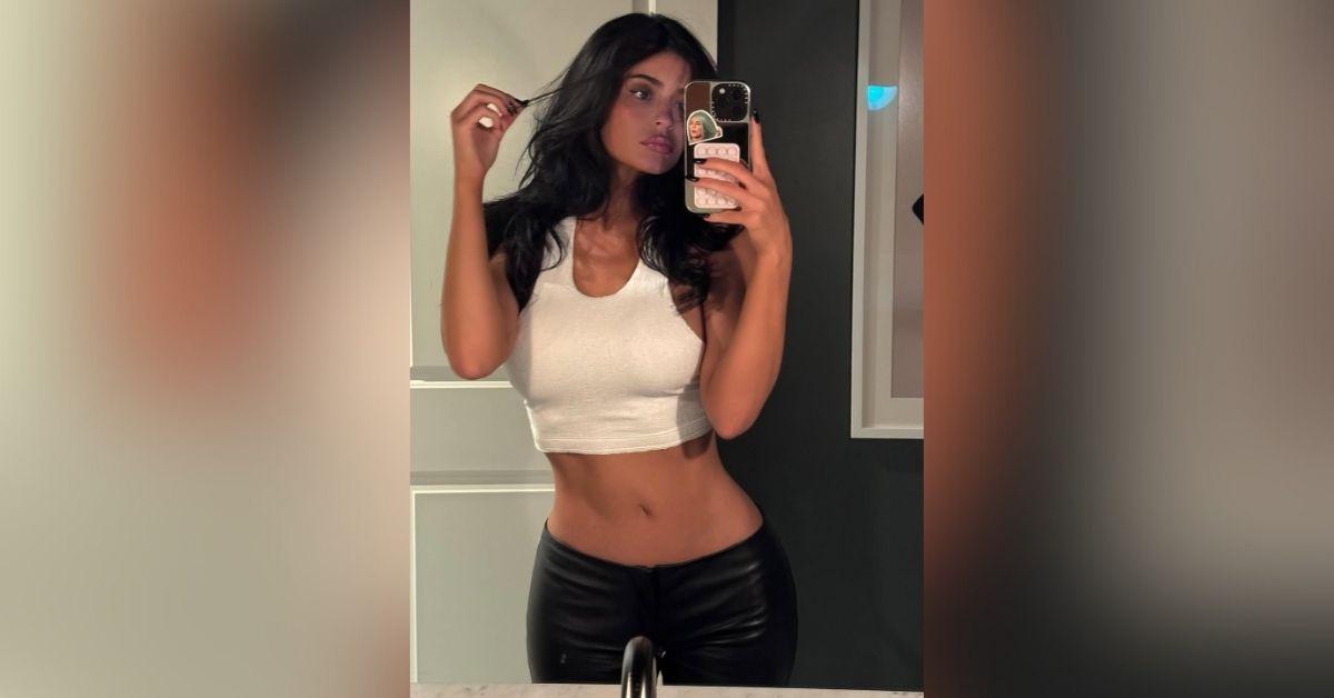 image of Kylie Jenner wore a tiny white crop top and leather pants.