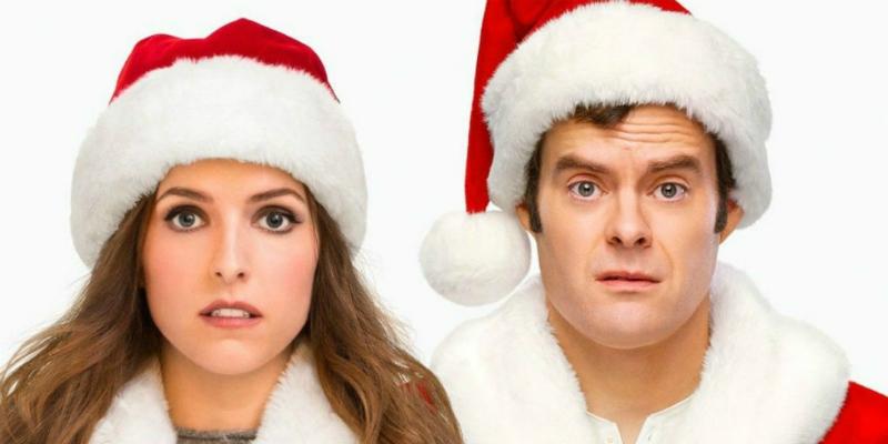 Anna Kendrick and Bill Hader, both in Santa hats, in a scene from Disney's Noelle.