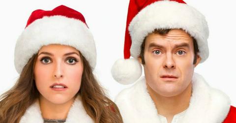 Anna Kendrick and Bill Hader, both in Santa hats, in a scene from Disney's Noelle.