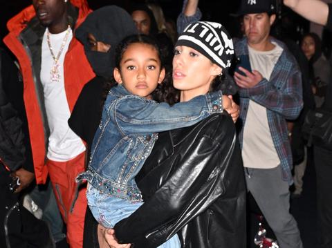 kanye wests wife bianca censori photo titanium teeth phone background