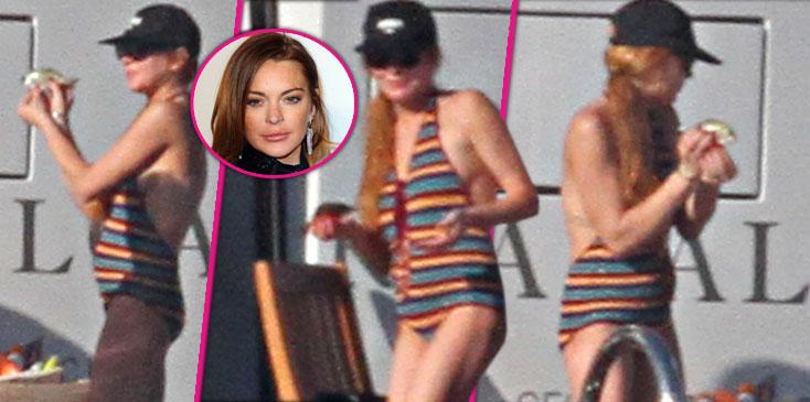 lindsay lohan pregnant baby bump one piece bathing suit