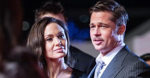 (FILE PHOTO) Brad Pitt and Angelina Jolie on red carpet in Japan