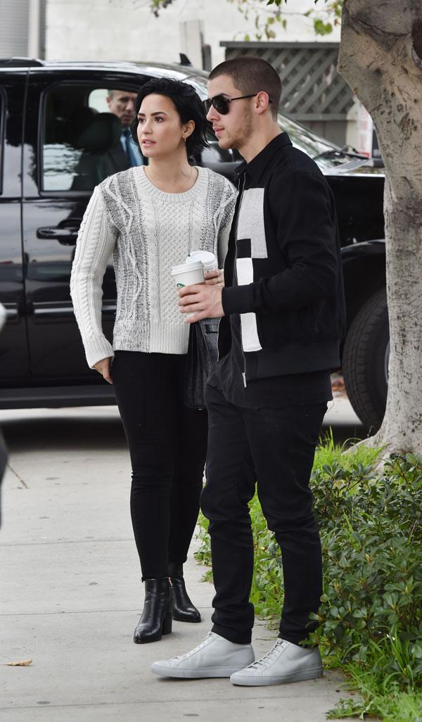 demi lovato nick jonas hugging while getting coffee