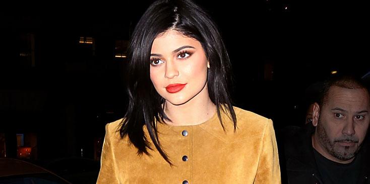 Kylie Jenner looks striking in a mustard green suede dress and thigh high boots while out in NYC.