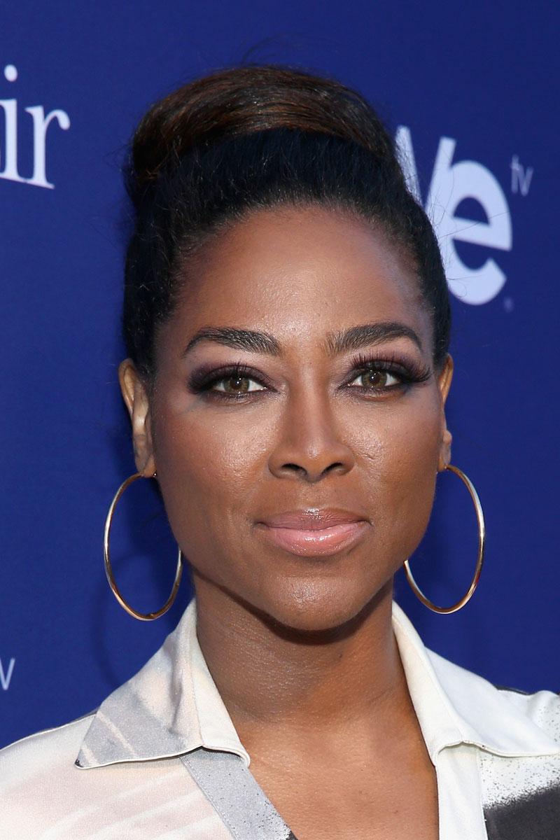 Kenya moore pulls gun home invasion trespessers instagram rhoa 07