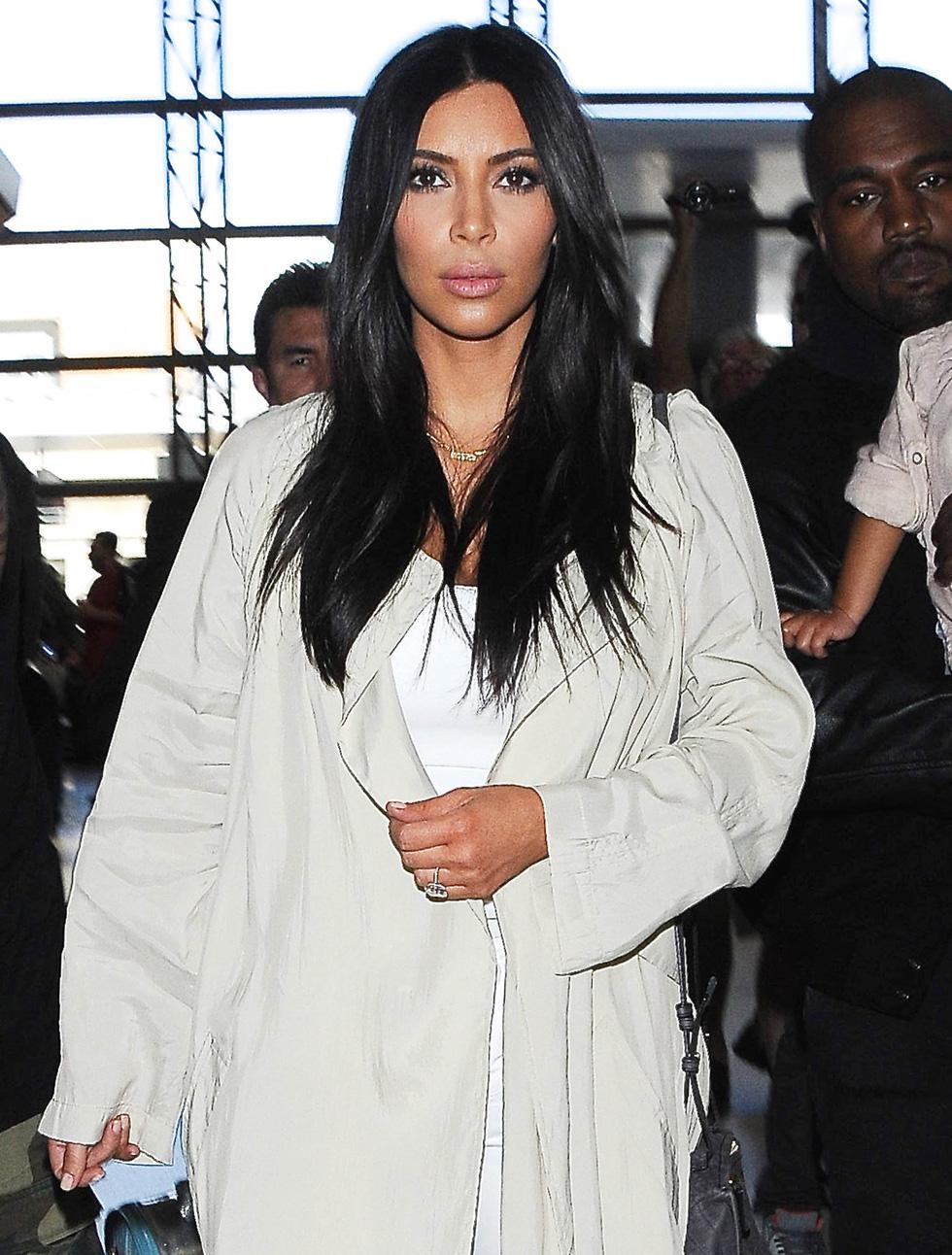 Kim Kardashian &amp; Kanye West Catch A Flight With North