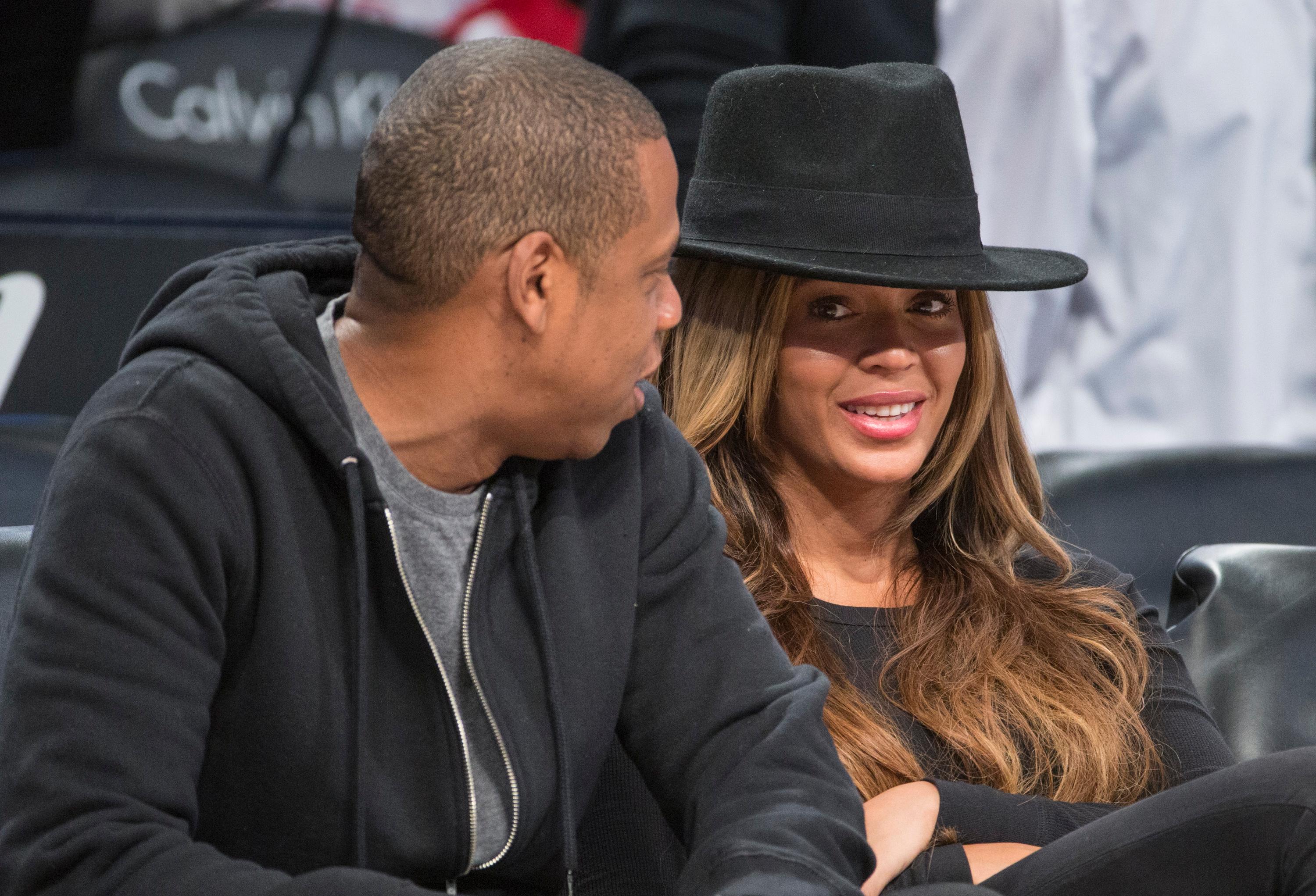 Jay Z and Beyonce sit courtside at the Brooklyn Nets game against the Houston Rockets