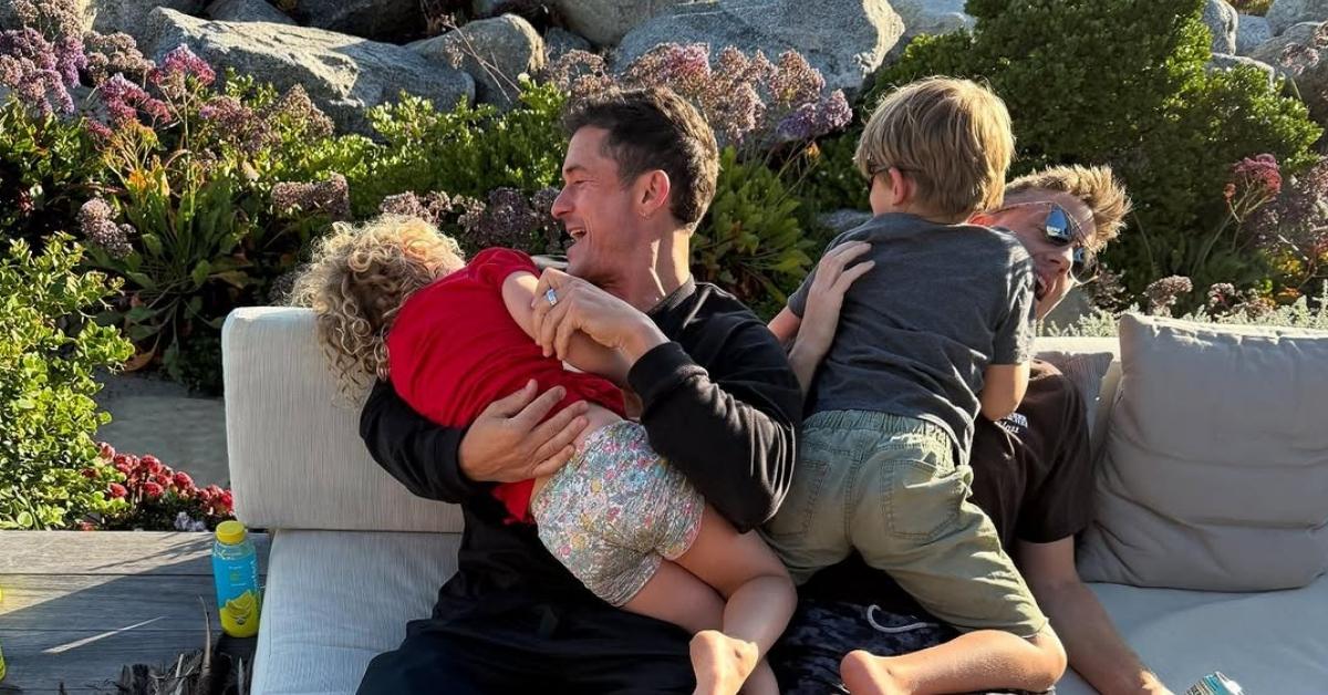 Image of Orlando Bloom with his son and daughter