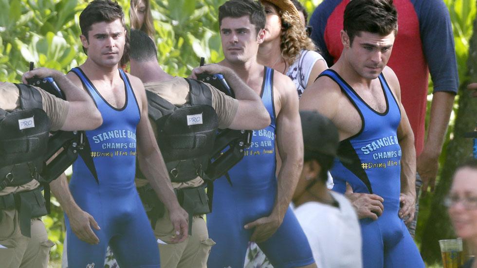 Zac Efron shows off his bulge wearing a spandex wrestling singlet on the Oa...