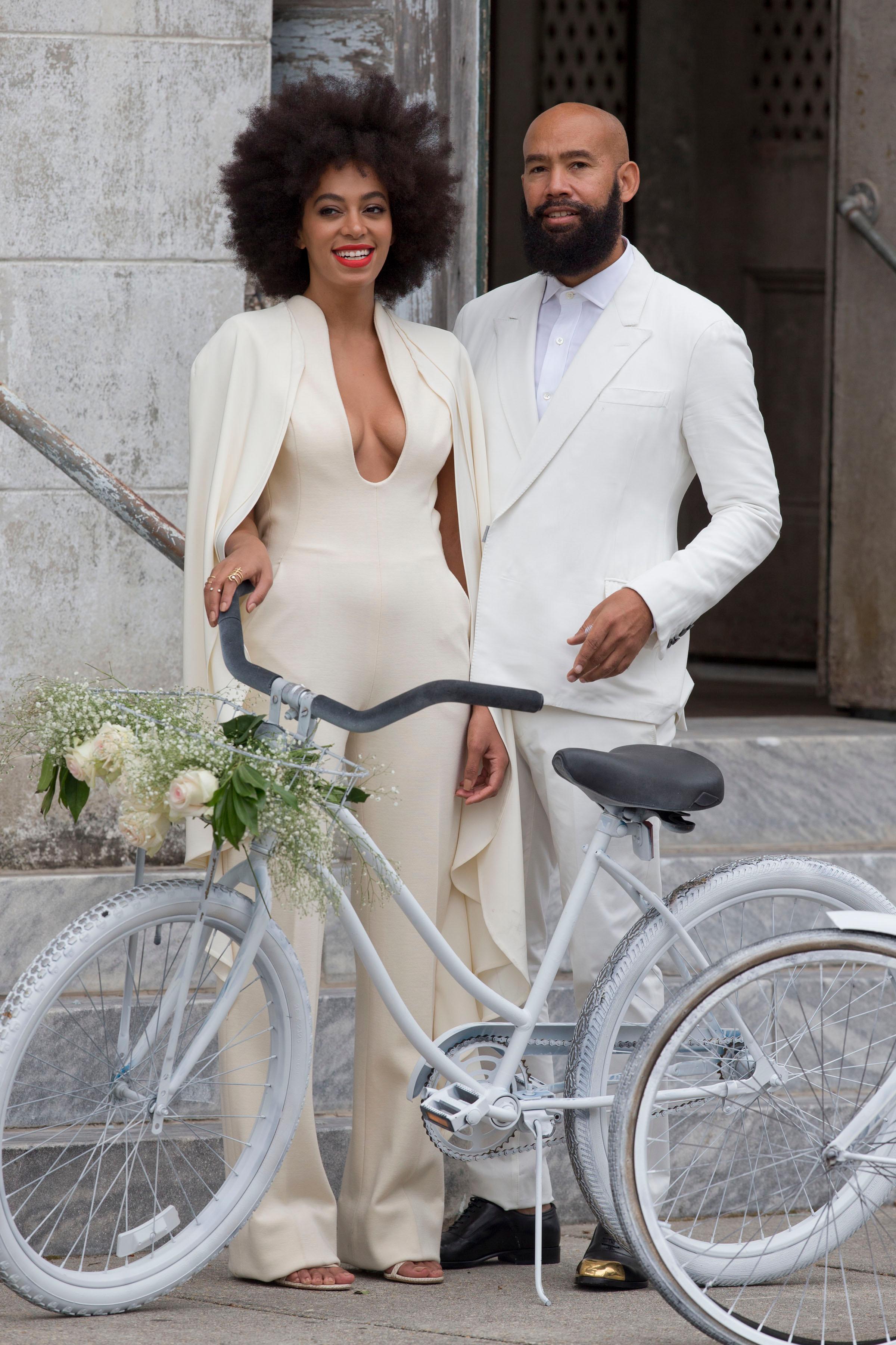 Solange Knowles and Alan Ferguson arrive at their wedding on white bicycles