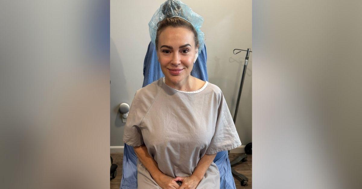 image of Alyssa Milano, 52, revealed she had her implants removed.