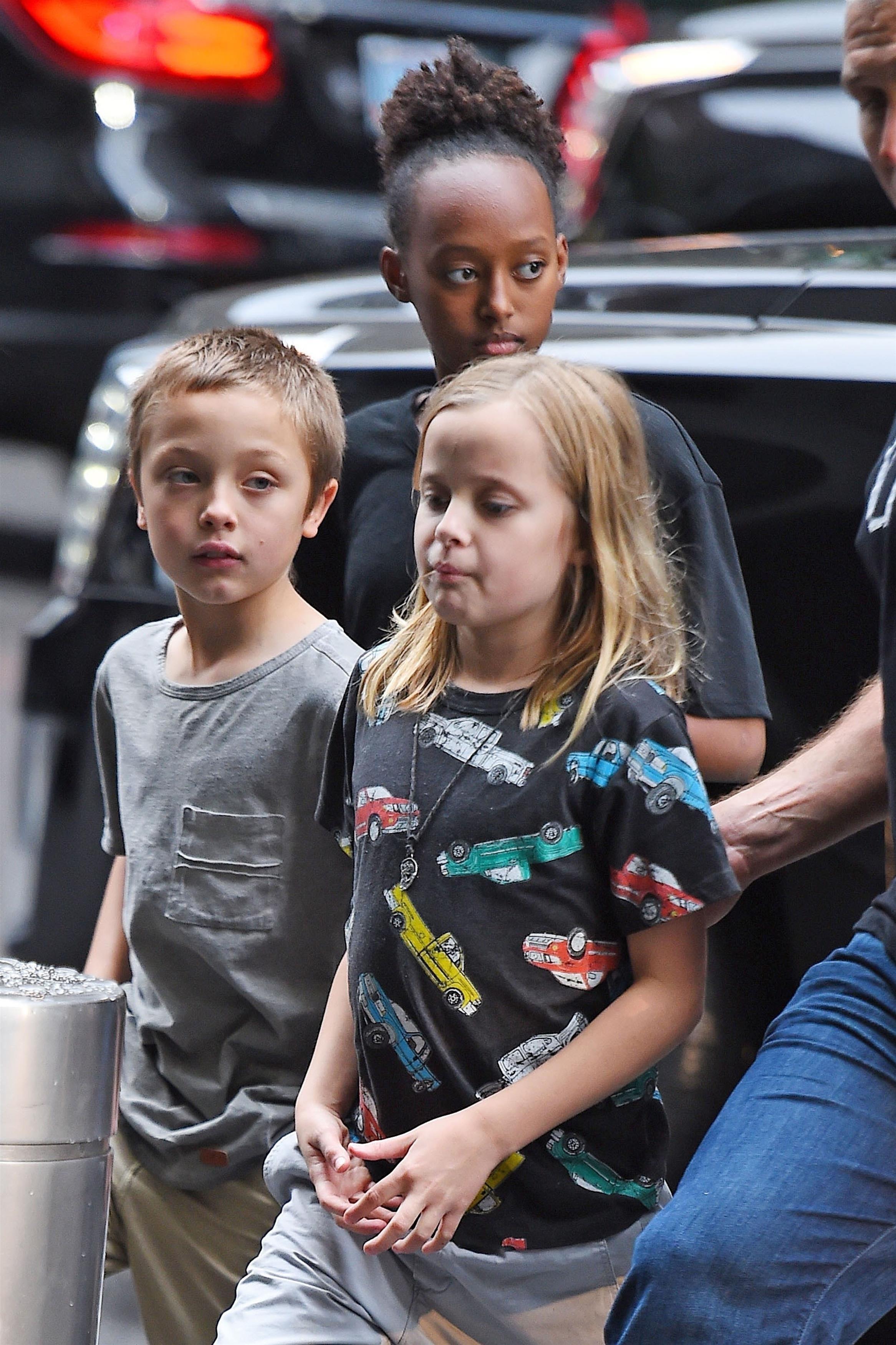 *EXCLUSIVE* Zahara, Vivienne and Knox Jolie Pitt arriving home with their security guards