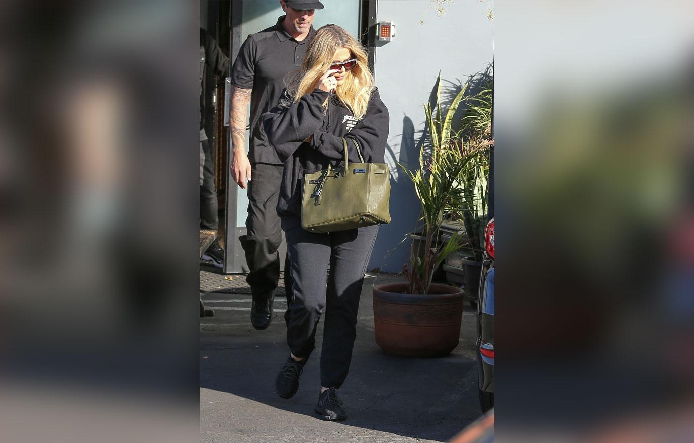 Khloe kardashian hides baby bump