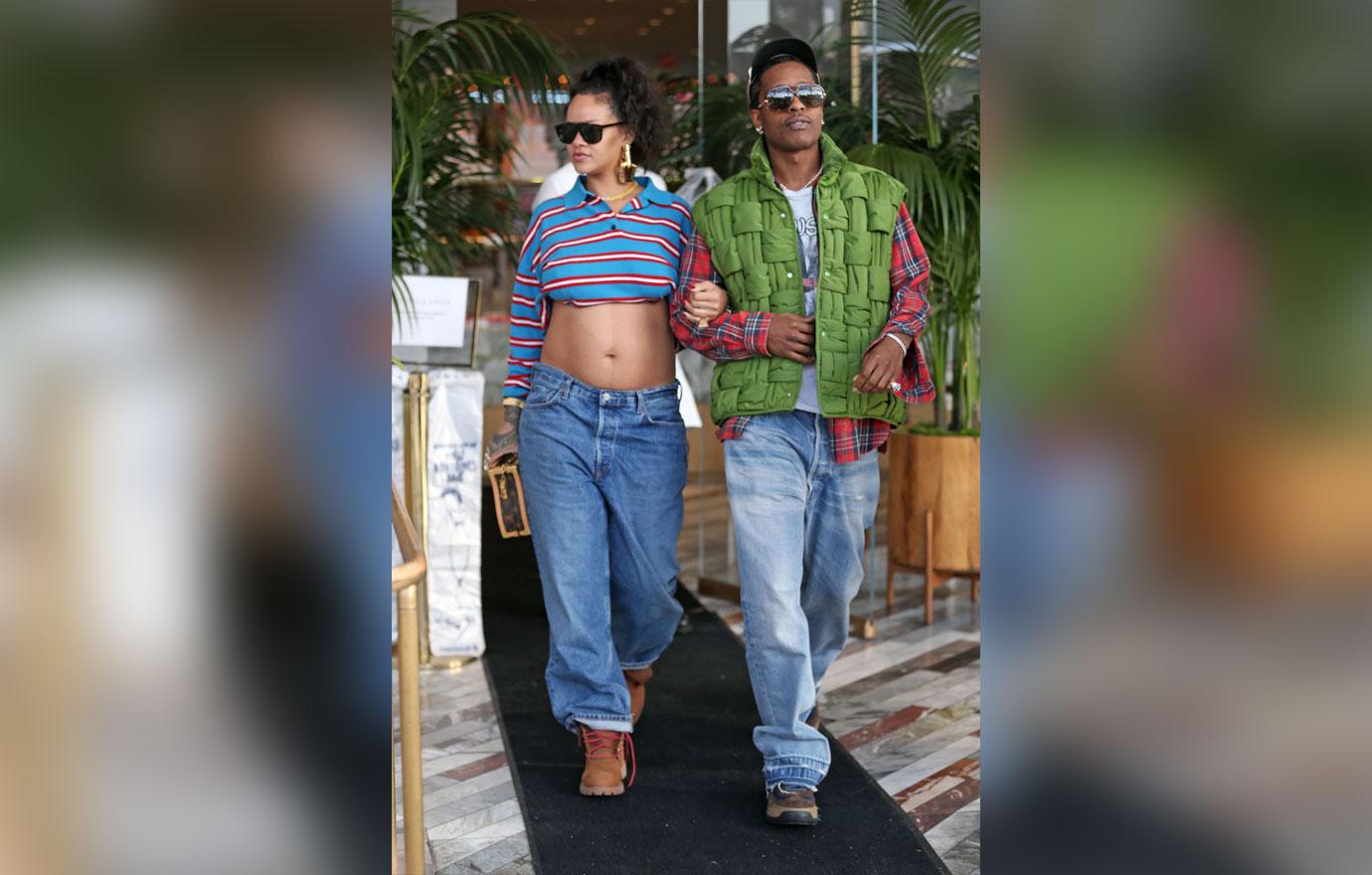 rihanna shows off baby bump as she walks arm in arm with aap rocky