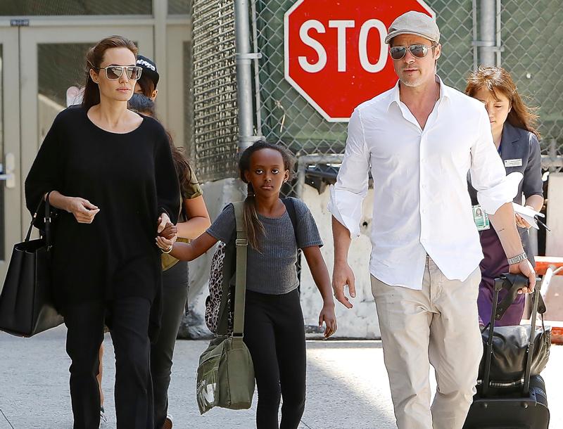 Angelina Jolie, Brad Pitt, Maddox and Zahara are seen at LAX Airport, CA.