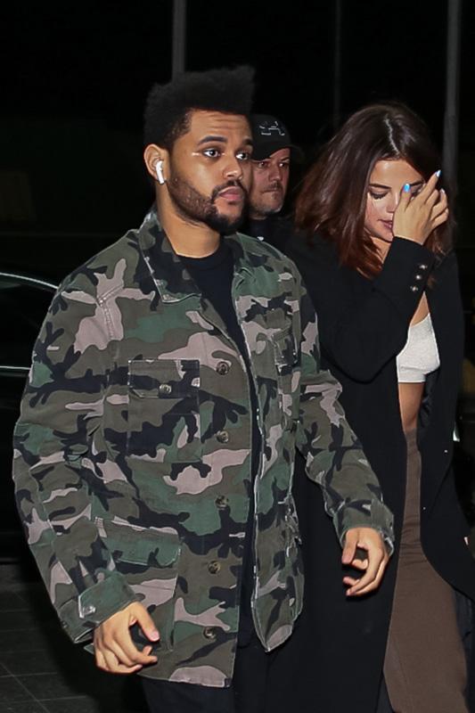 *EXCLUSIVE* The Weeknd and Selena Gomez keep close on their way to a flight after Lollapalooza Brazil