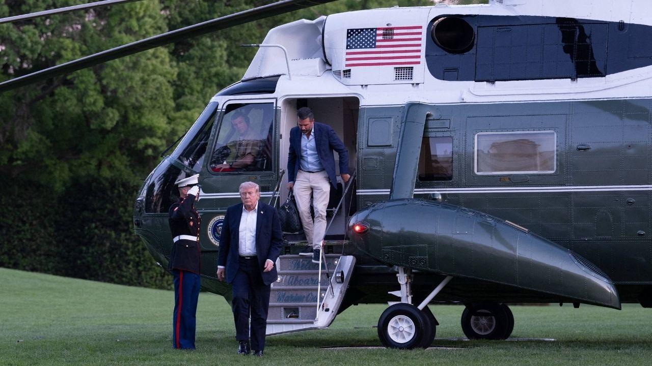 Image of Donald Trump pointed toward the cockpit during the brief exchange with the helicopter crew.