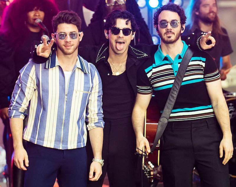 jonas brothers slammed rescheduling tour