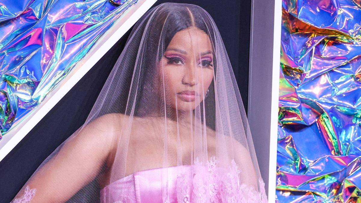 image of Teigen laughed and gave a thumbs-up during the joke.