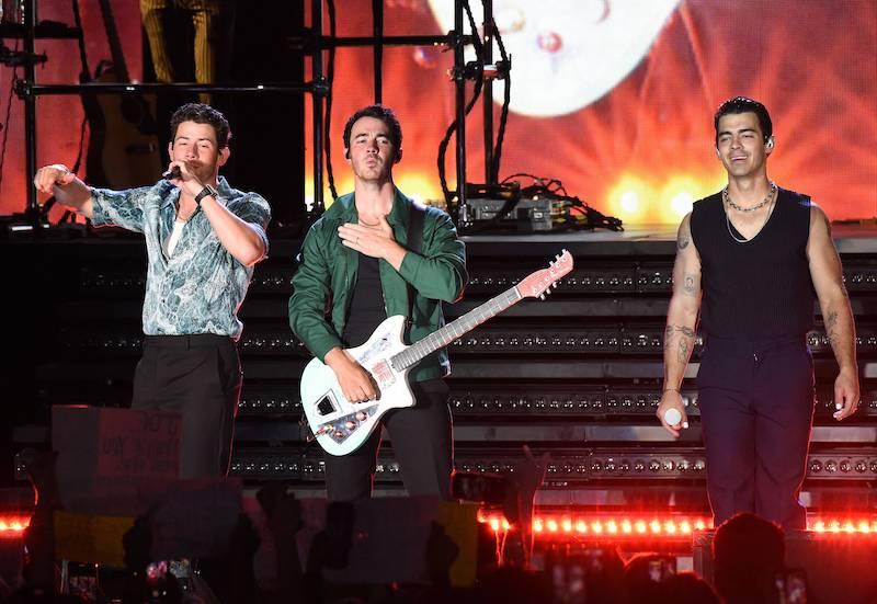 jonas brothers slammed rescheduling tour