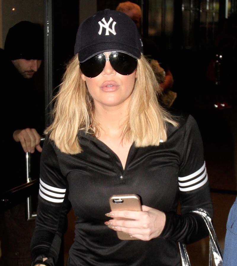 Khloe Kardashian leaves her spinning presentation and enjoys a &#8216;Smart Water&#8217; beverage while driving. Khloe left her class and went straight to the hospital to visit Lamar.