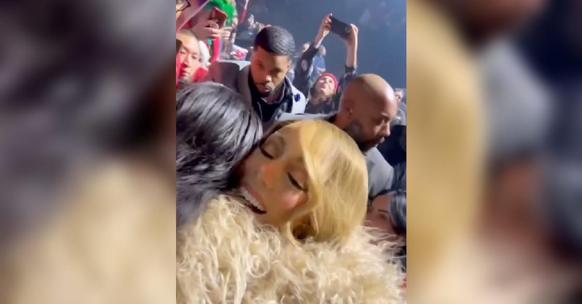 mariah carey signs rihanna chest christmas concert watch