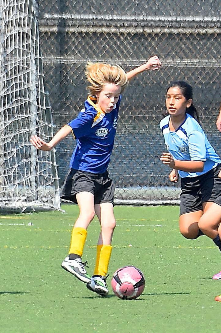 Shiloh and Zahara Jolie Pitt are accompanied by a bodygaurd to their Soccer Game in Studio City