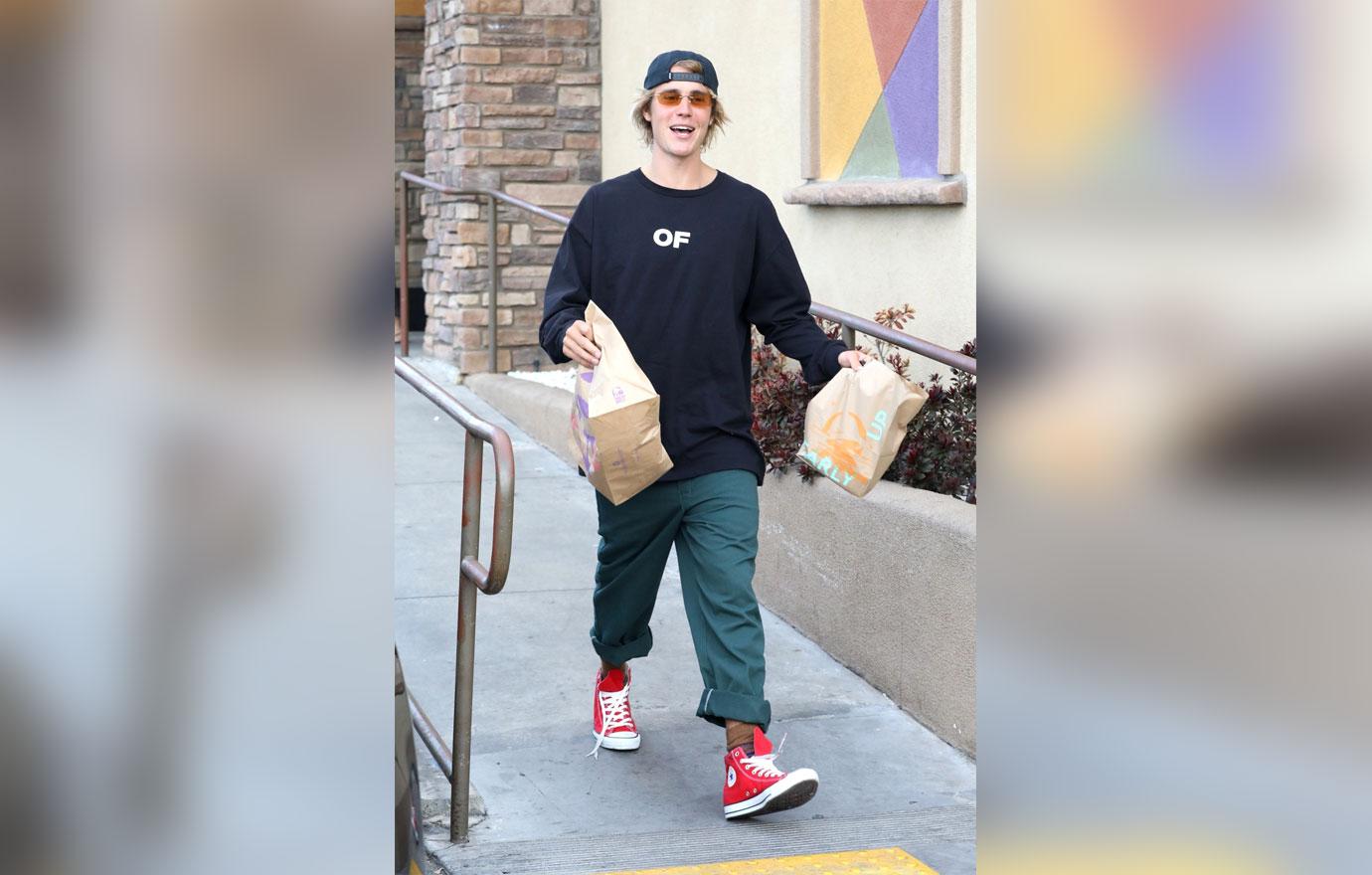 Justin Bieber looks happy to be getting Taco Bell