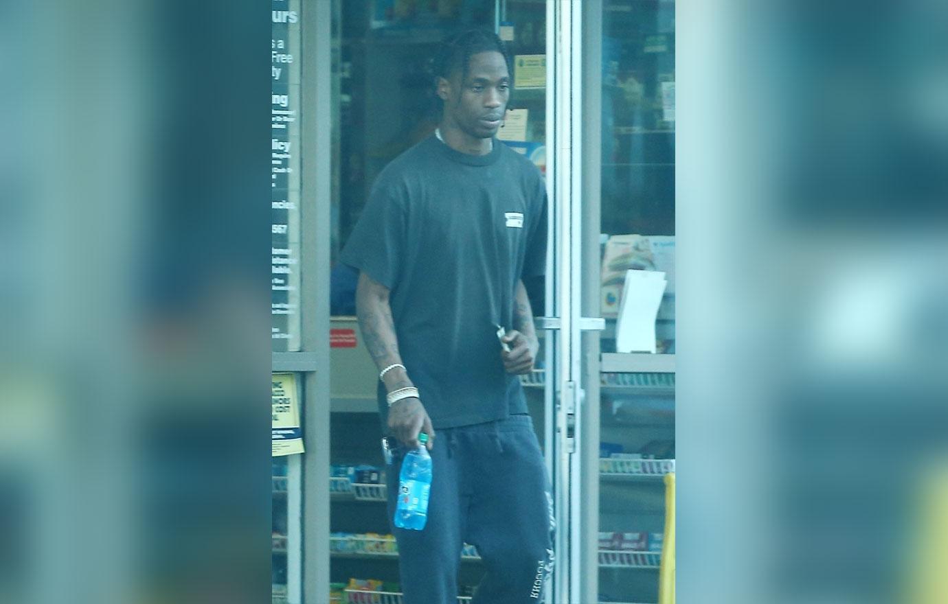 *EXCLUSIVE* New dad Travis Scott swings by a gas station to pick up a Fanta