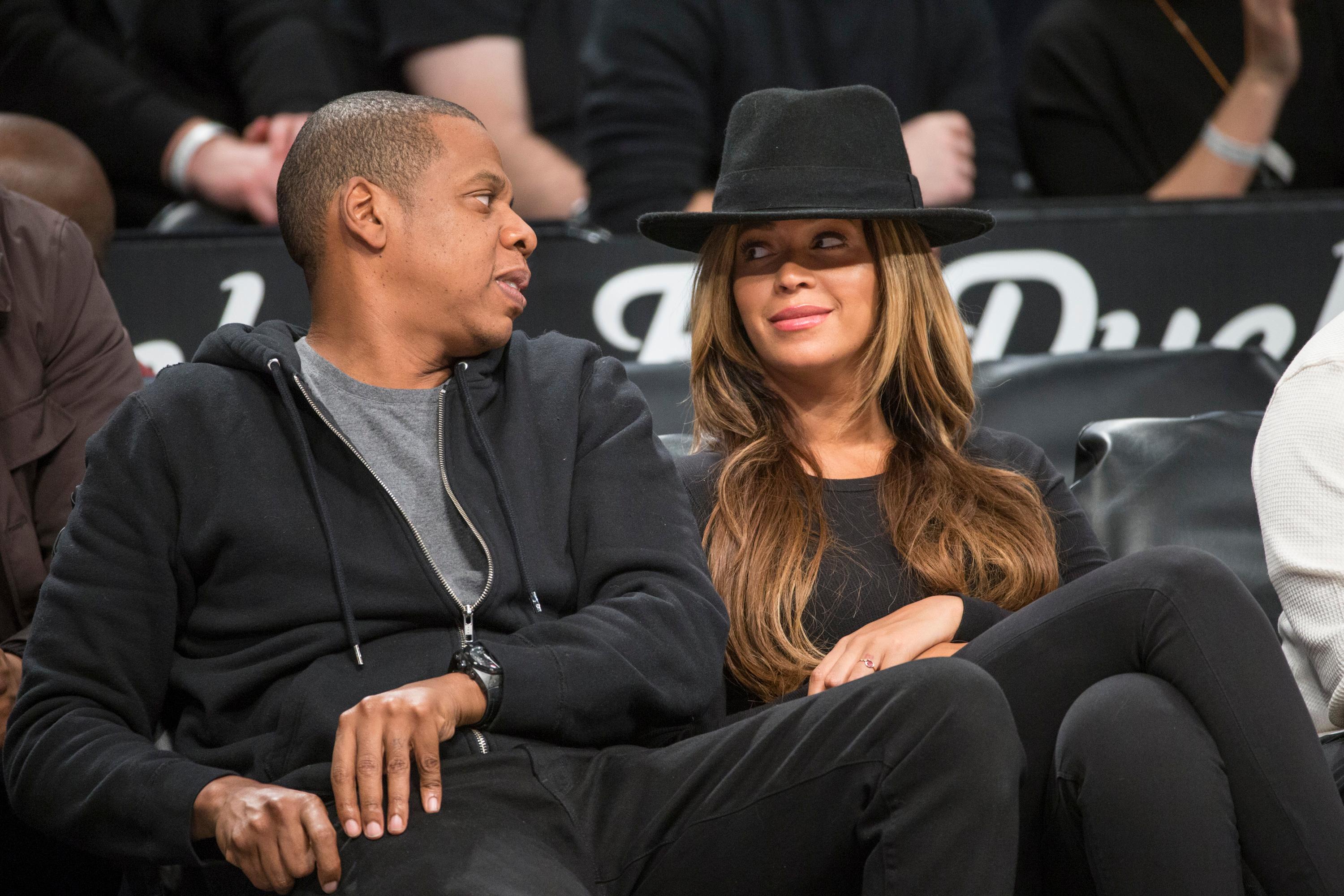 Jay Z and Beyonce sit courtside at the Brooklyn Nets game against the Houston Rockets