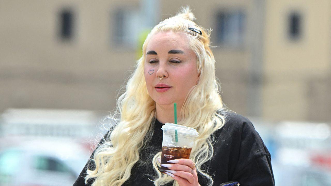 image of The former child star carried two iced coffees during the Los Angeles outing.