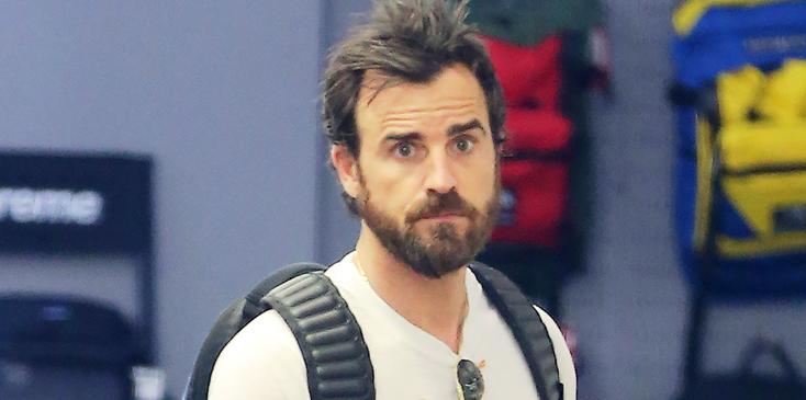 Justin Theroux looks at some sneakers in a boutique Soho store