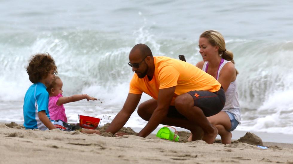 Kendra Wilkinson and Hank Baskett play happy families at the beach