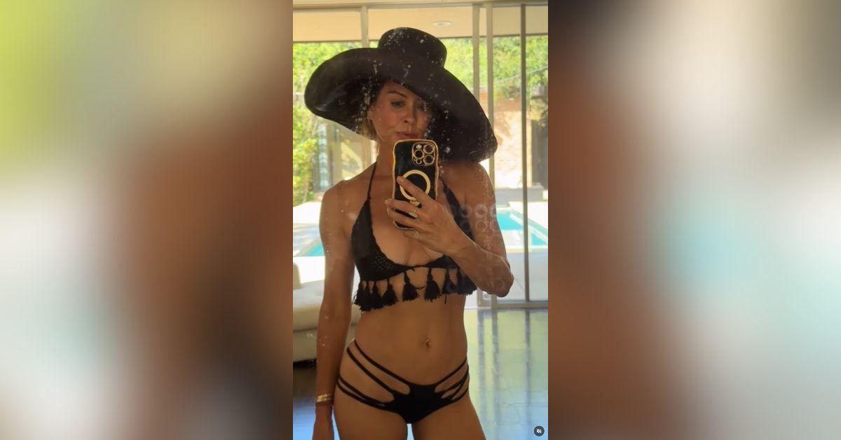 image of Brooke Burke shared a mirror selfie in a black bikini and encouraged followers to prioritize self-care and wellness.