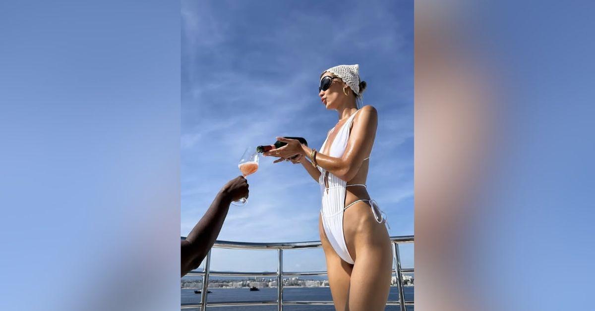 image of The model stunned in a peach miniskirt and matching bikini during her luxurious getaway.