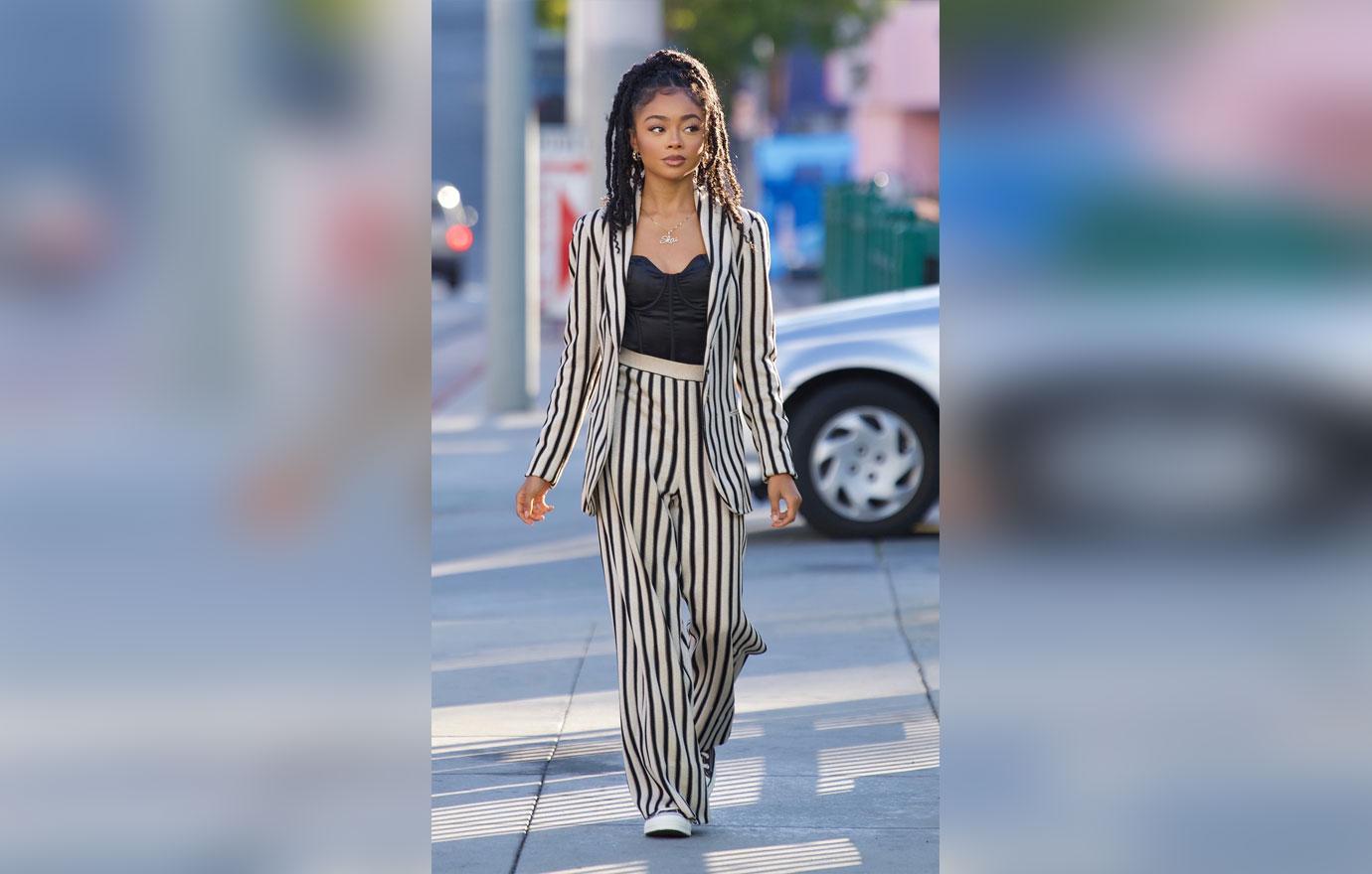 skai jackson steps out in striped pant suit