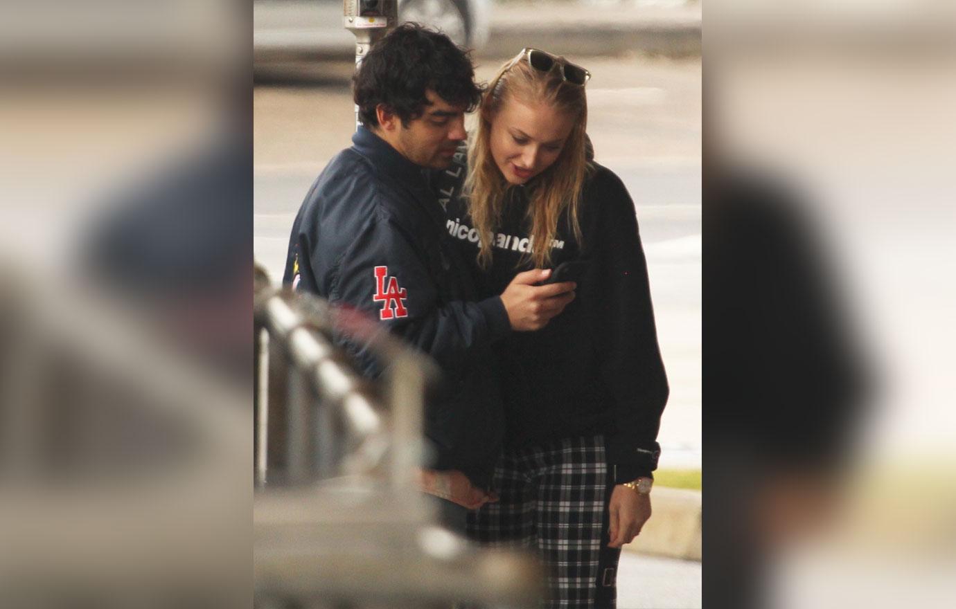 EXCLUSIVE: Joe Jonas and Sophie Turner share a kiss as they leave a Bondi cafe