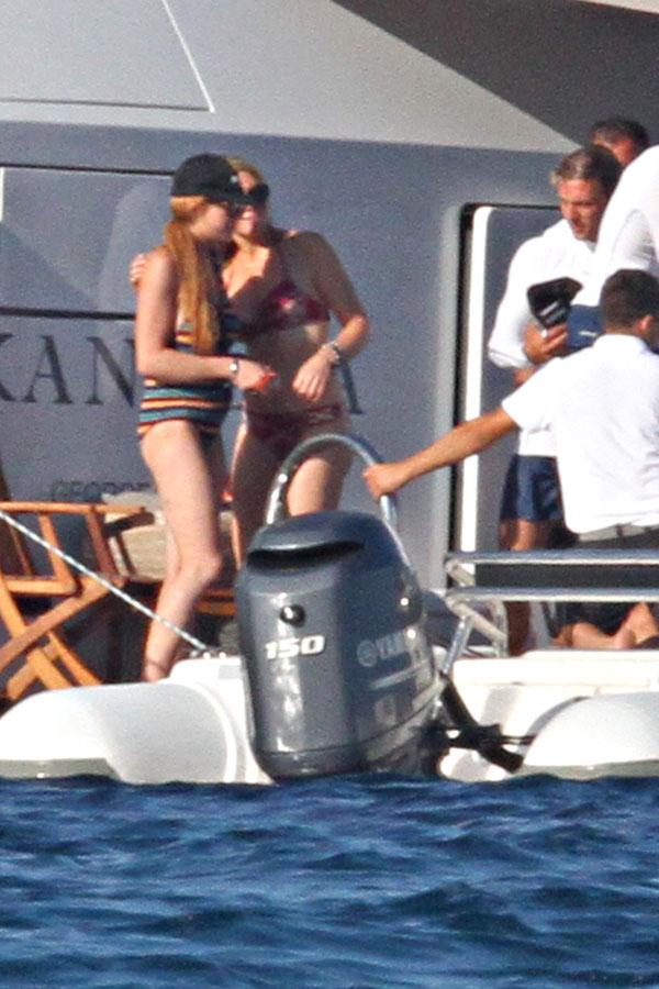 Pregnant Lindsay Lohan Shows Off Bump in Black Bathing Suit