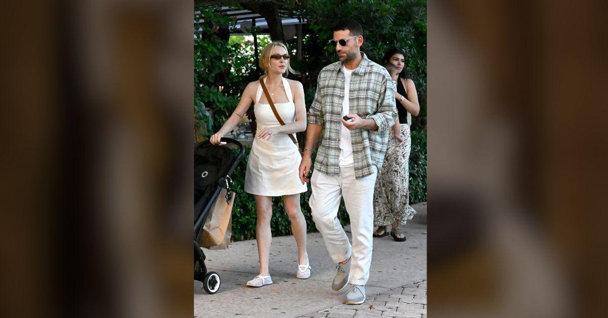 image of Lohan donned a white tank minidress, slip-ons and large black sunglasses for the outing.