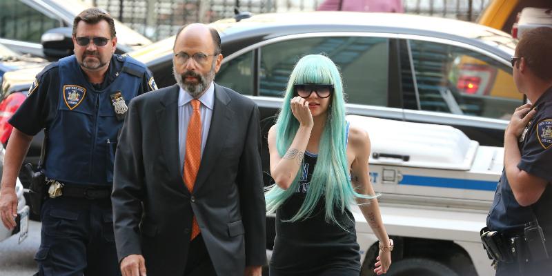 Amanda Bynes walks around New York City with blue scarf covering