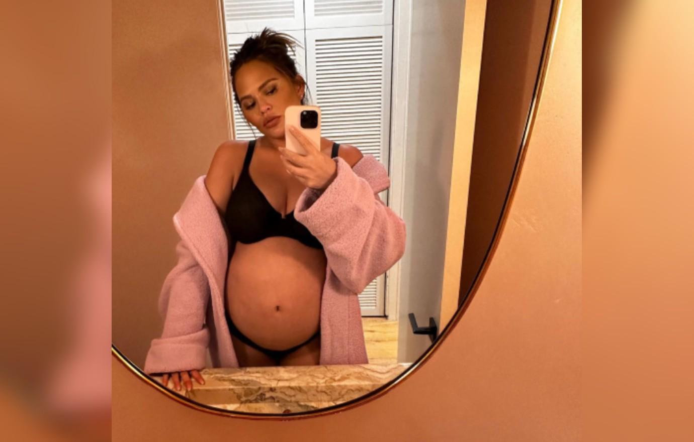 Pregnant Chrissy Teigen Shows Bare Baby Bump in Bathroom Selfie