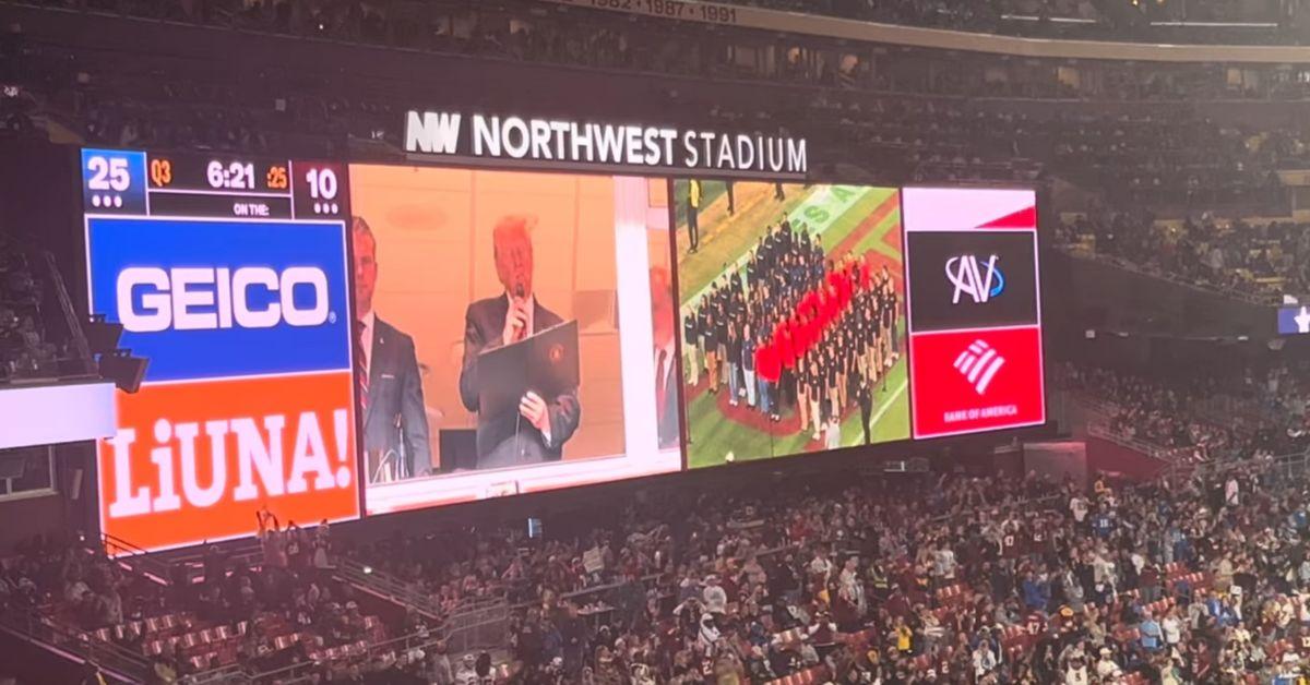 image of Fans reacted loudly when the president appeared on the jumbotron.