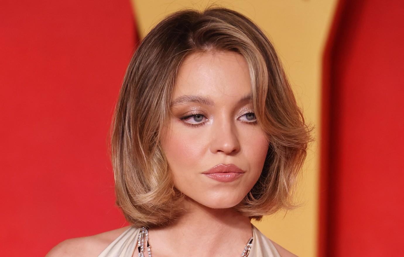 sydney sweeney stuns  met gala blue gown black bob