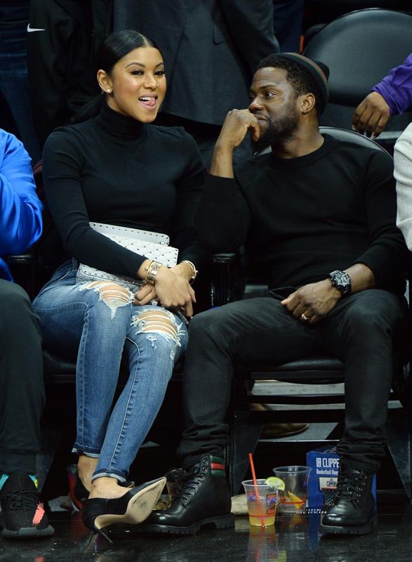 Kevin Hart and wife Eniko Parrish having a good laugh courtside at the Clippers game