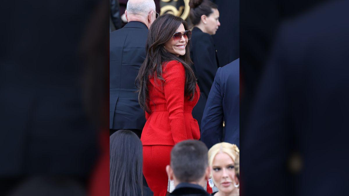 Image of Lauren Sánchez wowed in a red skirt suit while sitting front row at Schiaparelli.