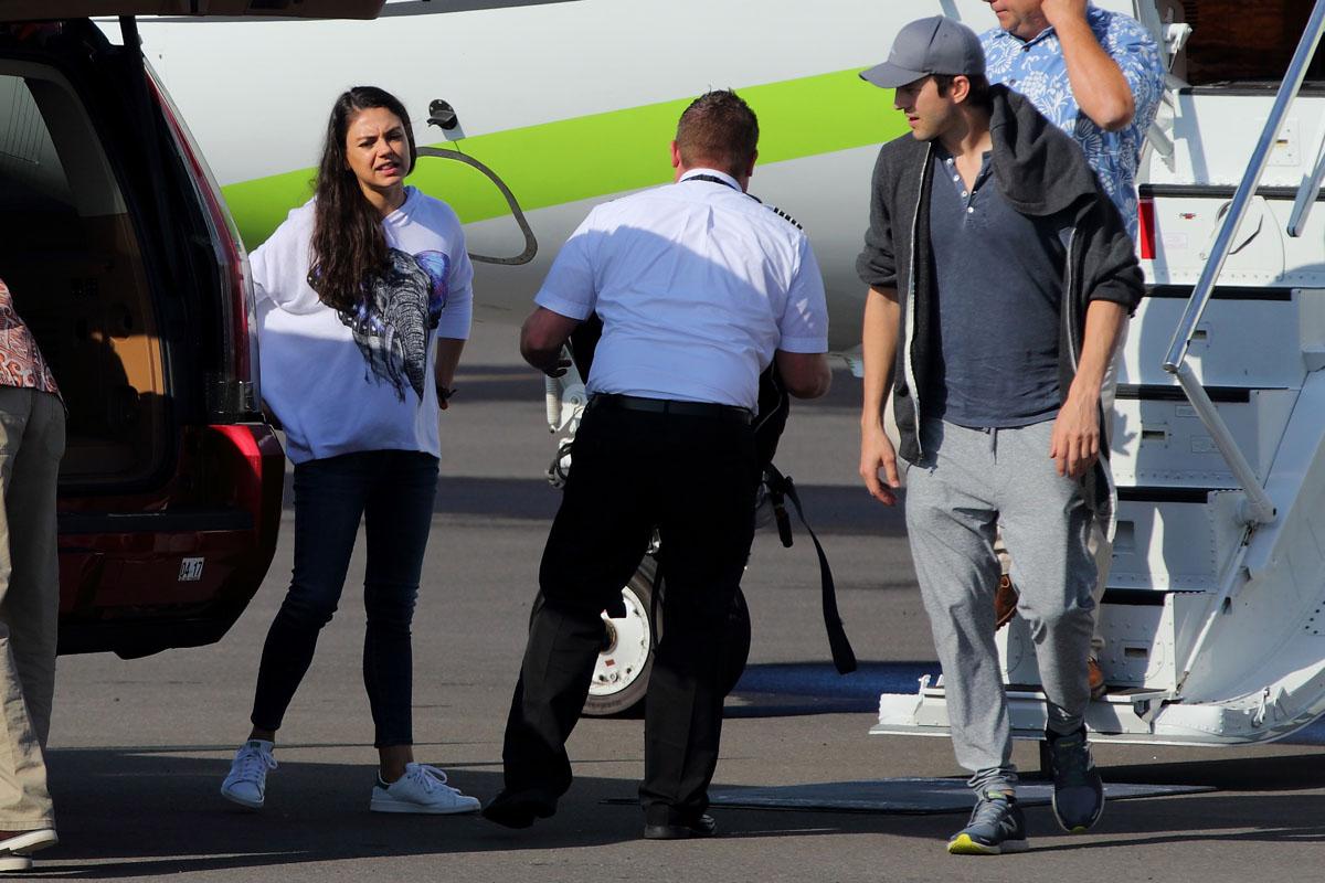 EXCLUSIVE: Ashton Kutcher and Mila Kunis were seen departing on private jet from Hawaii.