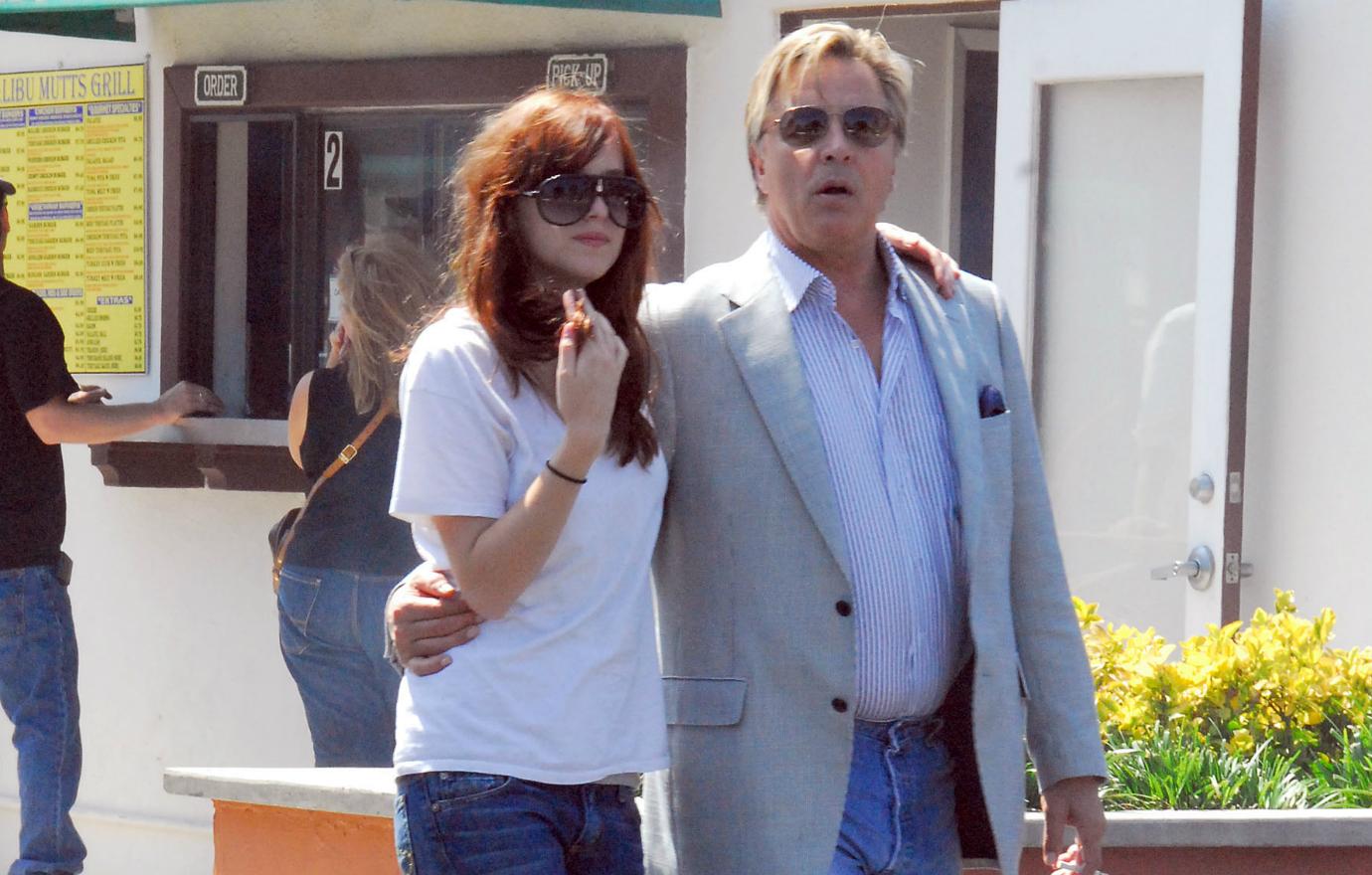 Dakota Johnson’s dad, Don Johnson, let the cat out of the bag on the Chris Martin relationship.