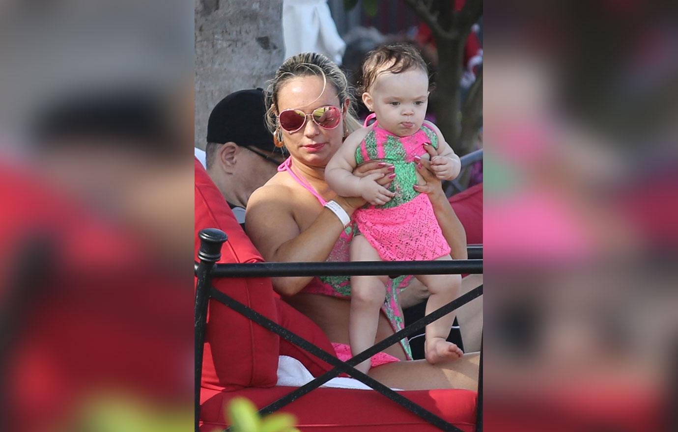 Ice T and Coco Austin relax poolside with baby Chanel