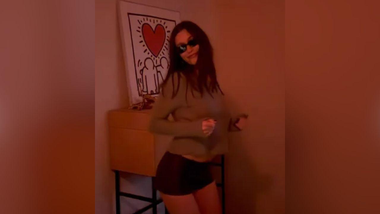 image of The Rhode founder completed her look with black strappy heels, slim sunglasses and a dark manicure.