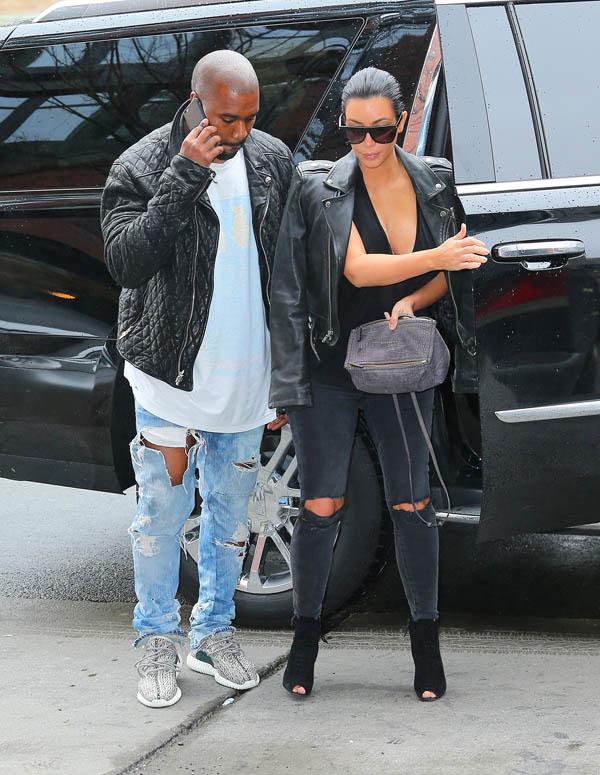 Kanye West smiles when shopping for baby clothes with Kim Kardashian at Trico Fields in NYC